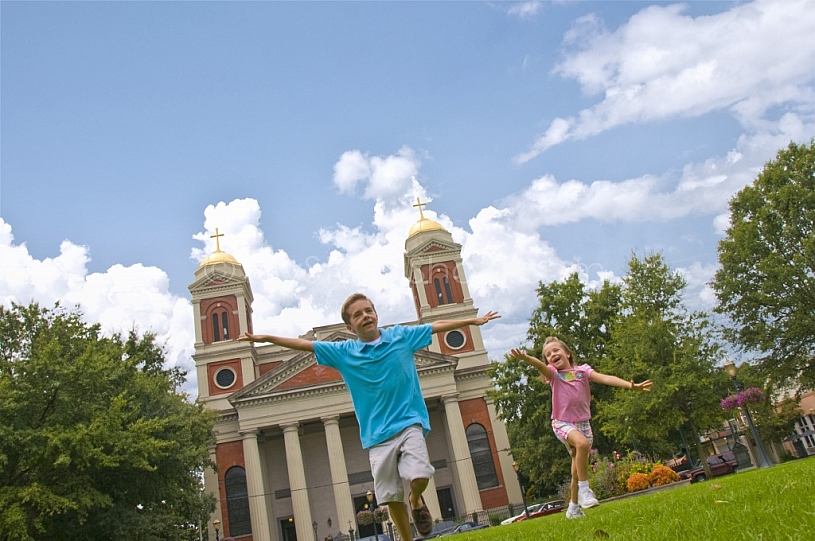 Kids in Cathedral Square - Fun Flying Airplane