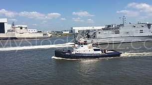 Austal USNS Yuma passes Tug