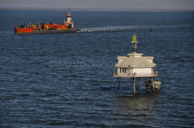 Ship passing Middle Bay Light