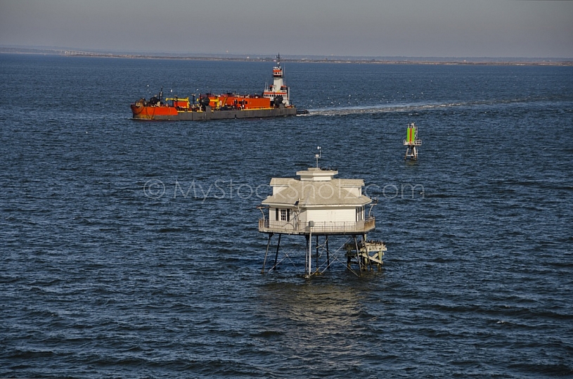 Ship passing Middle Bay Light