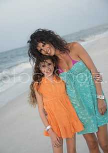 Mom and daughter enjoying the beach