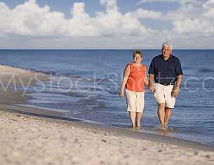 Couple walking the beach in Gulf Shores, Alabama