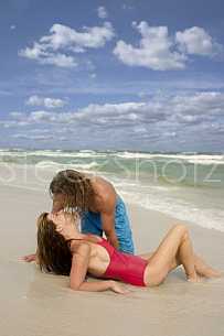 Couple kiss at the beach