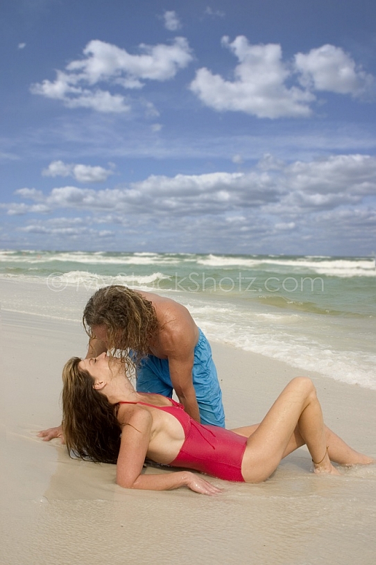 Couple kiss at the beach