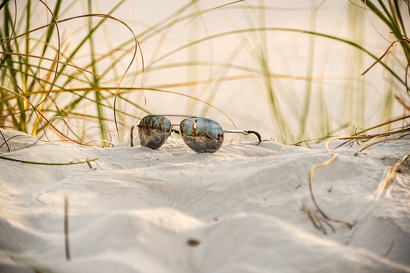 Sunglasses in the sand at the beach