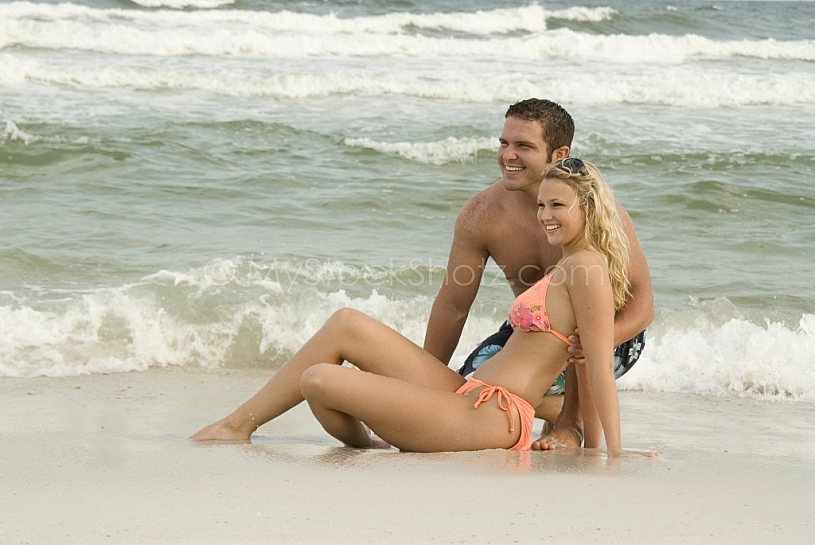 sand sitting and smiling