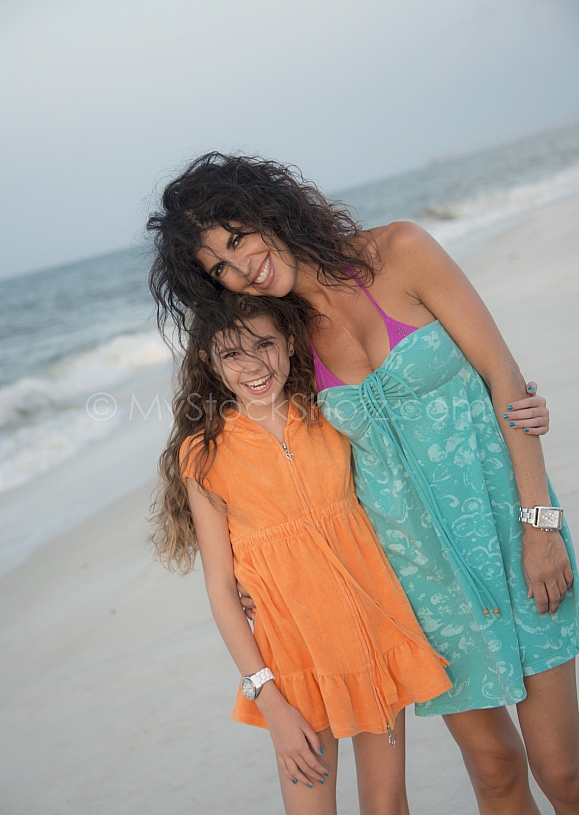 Mom and daughter enjoying the beach